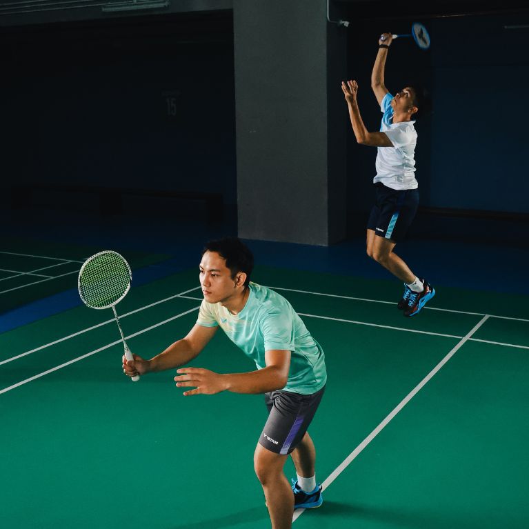 A man playing badminton